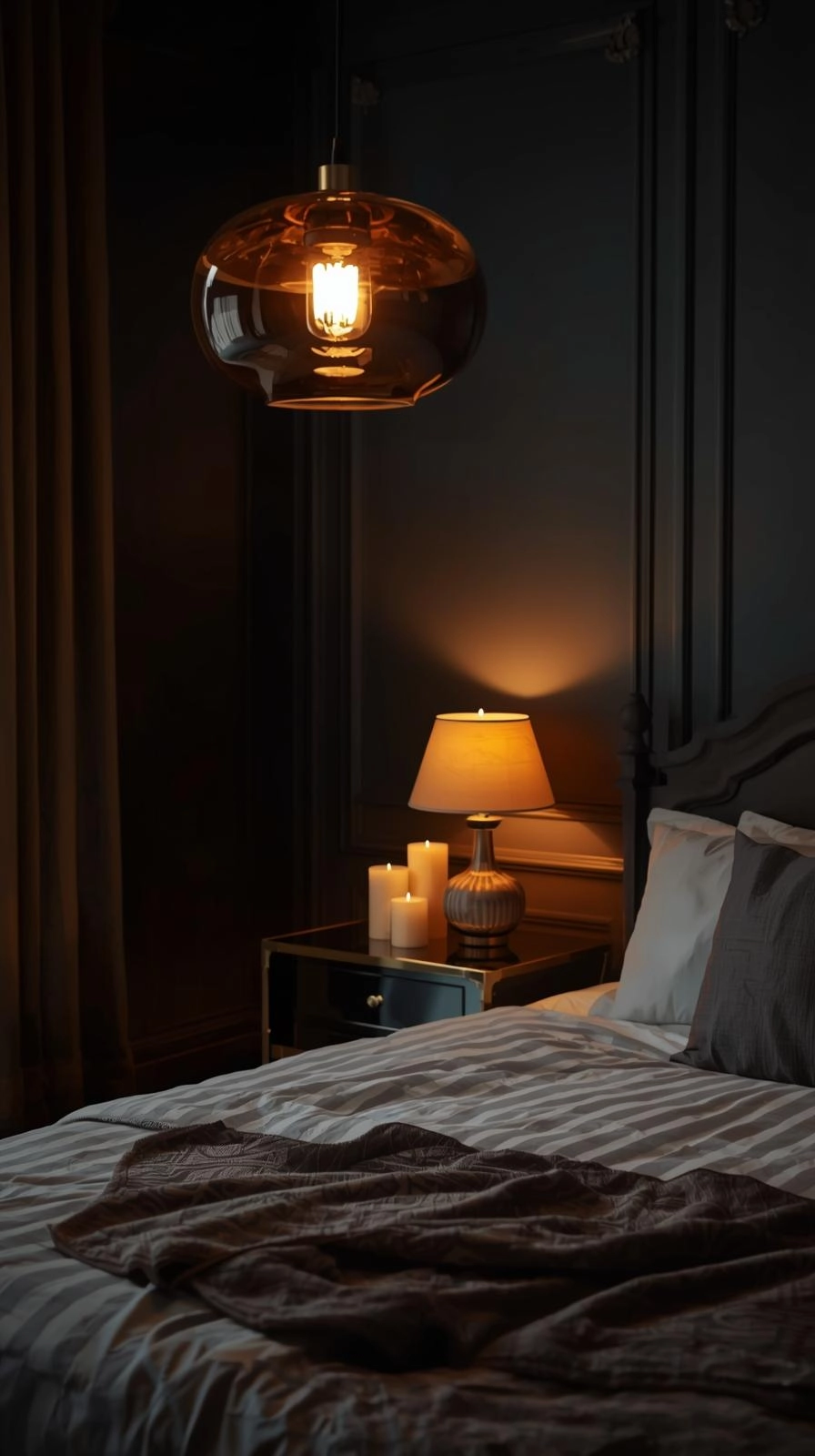 Dark feminine aesthetic room with warm layered lighting, pendant lamp, candles, and reflective surfaces creating a soft glowing atmosphere.